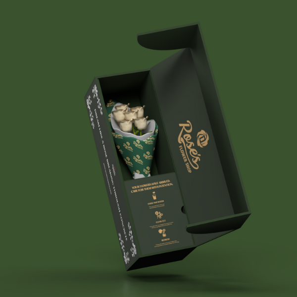 cream roses in delivery box on green background