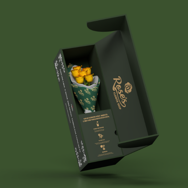 yellow roses in delivery box on green background